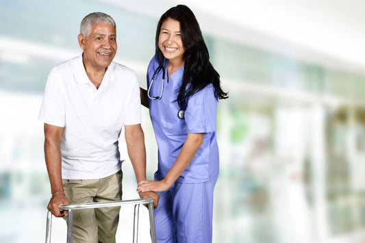 Nurse helping man in walker